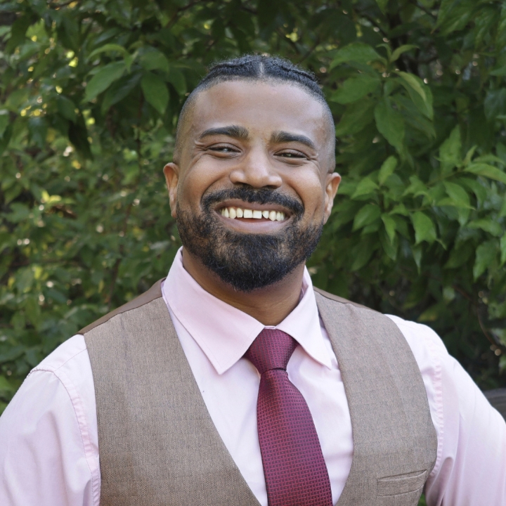 Jason Mentor, Kaleidoscope Adventures team member, smiling outdoors in a vest and tie.