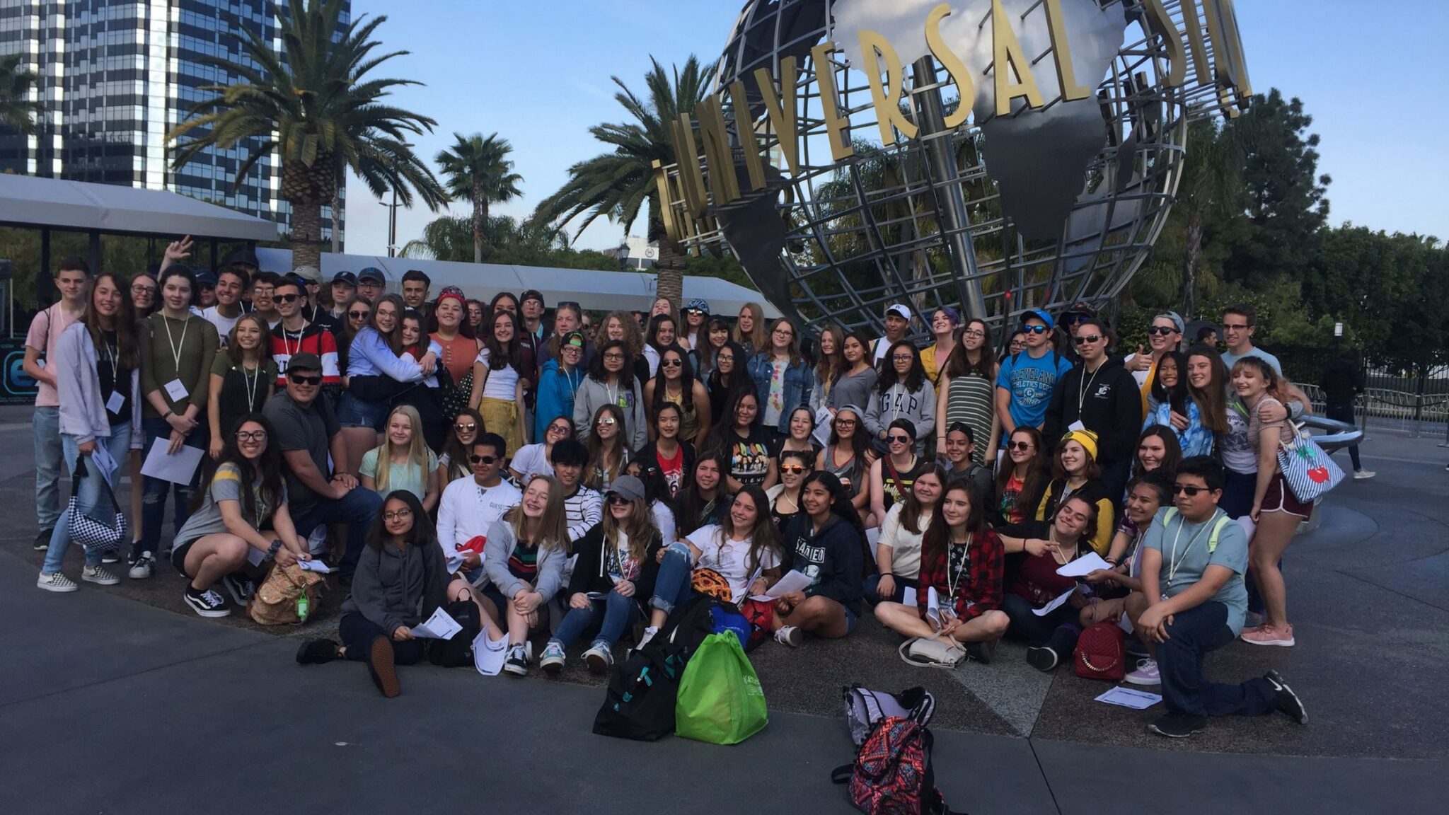 large group of teens outside of Hollywood Studios in California