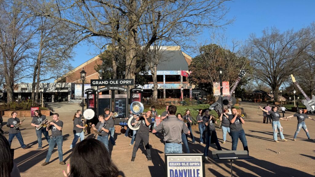 a hs band playing in front of the the Grand Ole Opry in Nashville