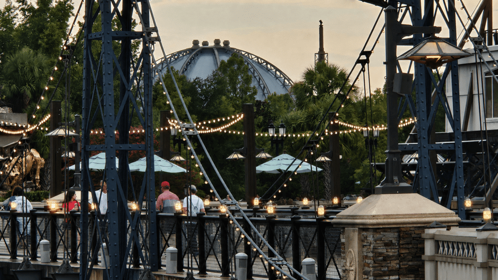 pedestrian bridge at Disney springs lit up at eveningtime