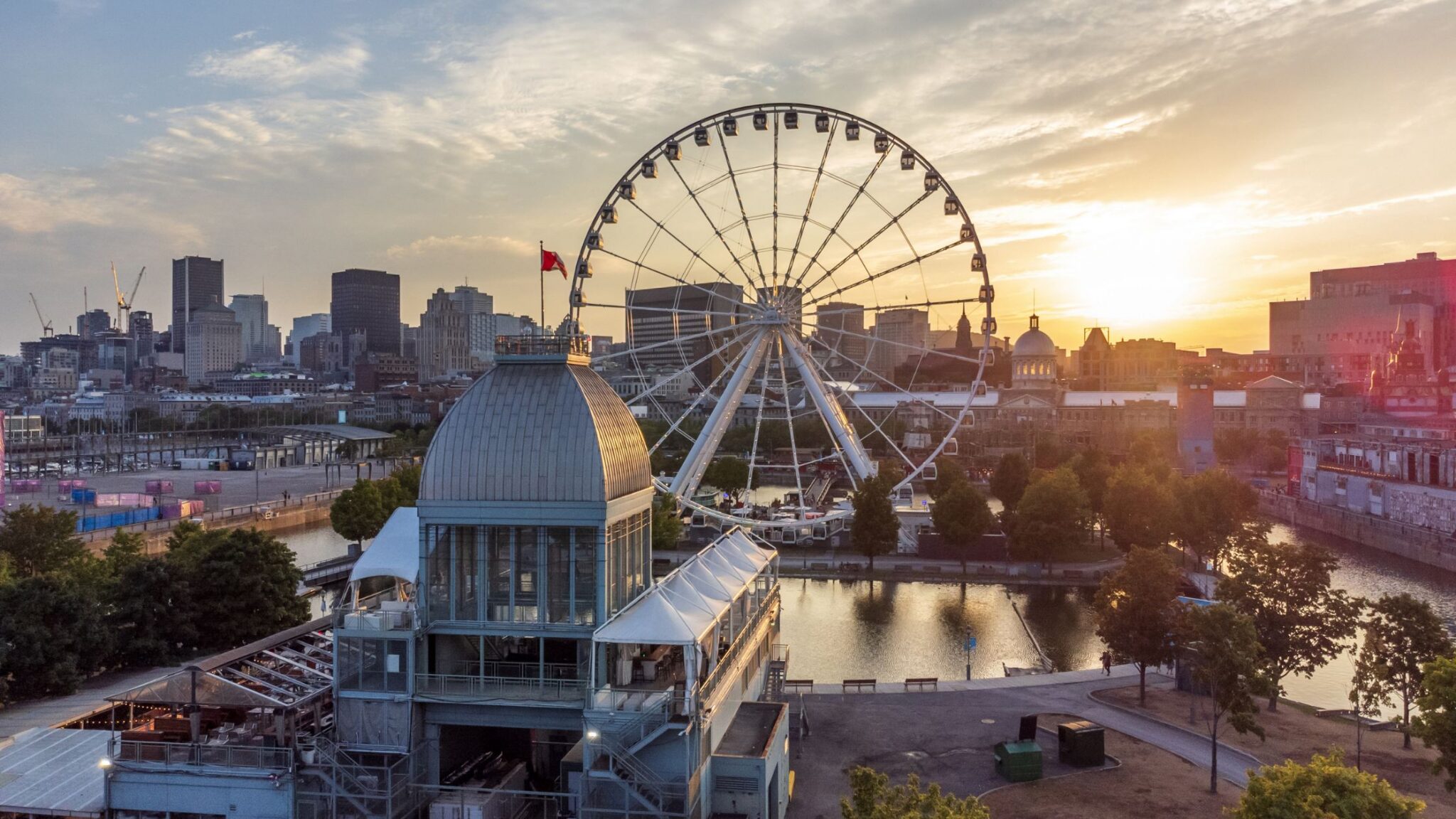 ferris wheel overlooking city of Montreal at sunset