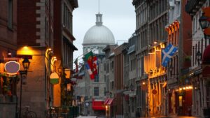 street view of Montreal with flags flying along the street