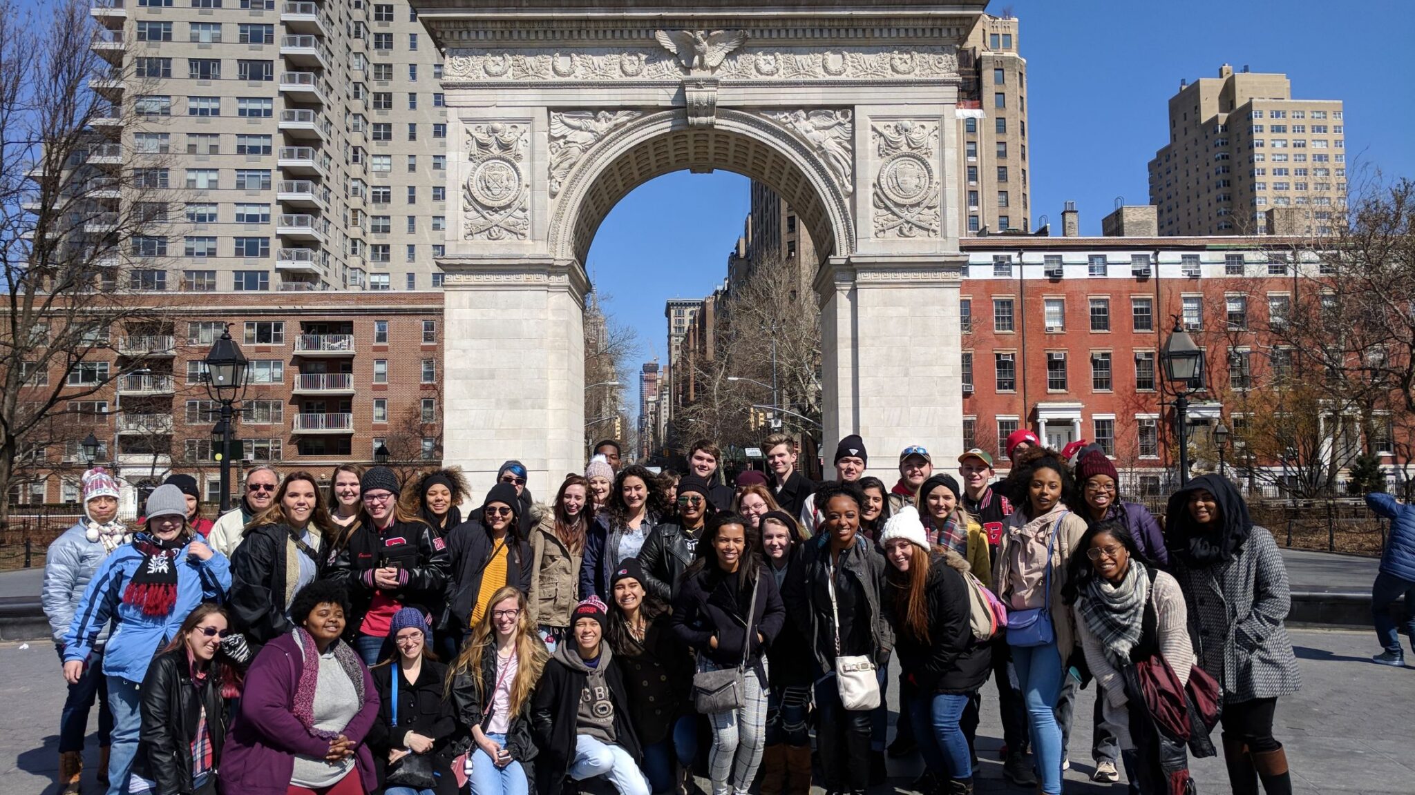 group of older teens posing for a photo in NYC
